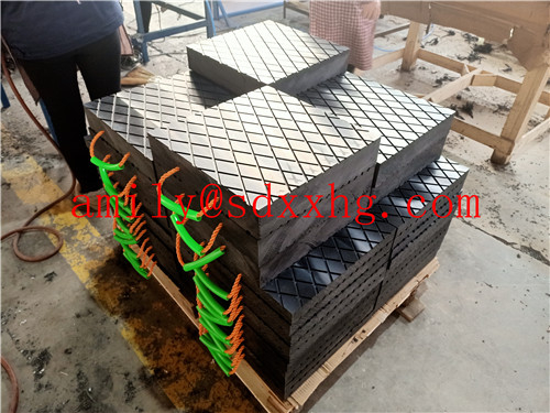 Black mobile crane outrigger pads